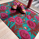 Droogloopmat met zachte lila klaprozen op een zeegroene achtergrond. Een frisse, subtiele bloemenprint die het voorjaar in huis brengt.