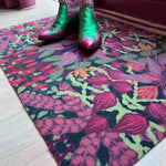 Droogloopmat Jungle Drum met tropische print in groen, knalroze en oranje van Studio LilaLine